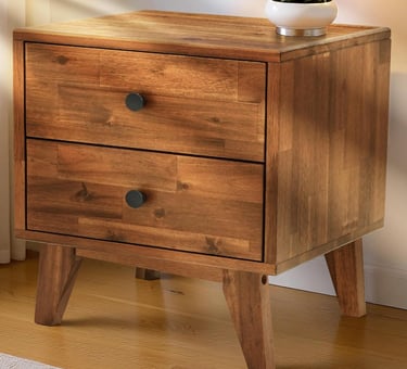 Mid-century modern solid wood nightstand with two drawers and black knobs for bedroom storage.