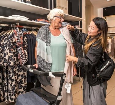 an elderly woman in a dress shirt and a stroller