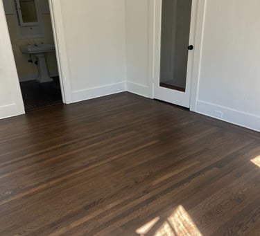 a room with a wooden floor and a door