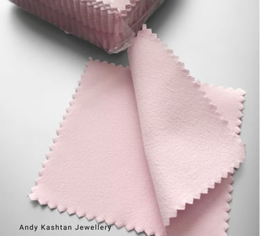 a pink and white cloth with a pink ribbon