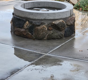 natural stone gas firepit on patio