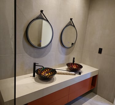 Expert plumber upgrading bathroom fixtures in UAE home with modern faucets and sinks