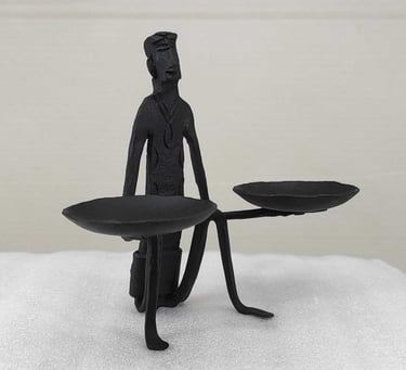 "Handcrafted tribal iron sculpture-man with oil lamps-right side-for global markets"
