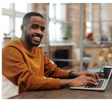 Expert Writer working on laptop