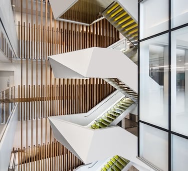 Portrait photo showing the other green modern feature stairs at Deloitte, by Pengelly Iron Works