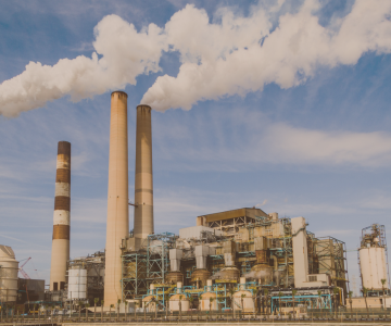 a factory with smoke stacks and smoke stacks