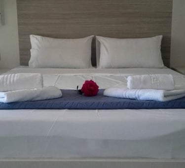 a bed with towels and towels on it
