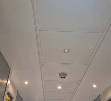 MF ceiling meeting a suspended ceiling