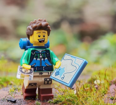 a lego - man holding a map and a map