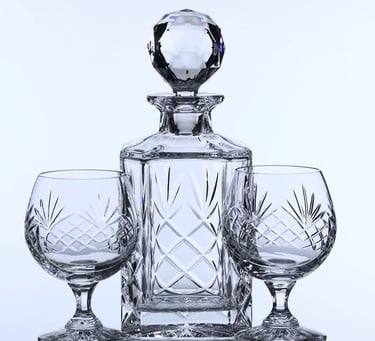 a glass decanter & crystal glasses