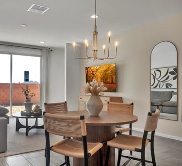 a dining room with a table and chairs