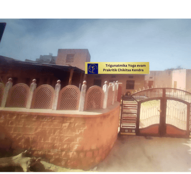 a gated entrance to a building with a sign that says,'welcome to