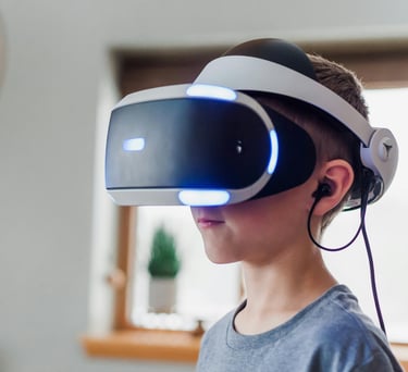 A boy wearing a virtual reality headset
