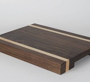 a cutting board with a wooden cutting board