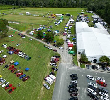 a large field with many cars parked in it