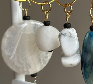Rosevale Accessories handmade gemstone wine charms on jewelry display