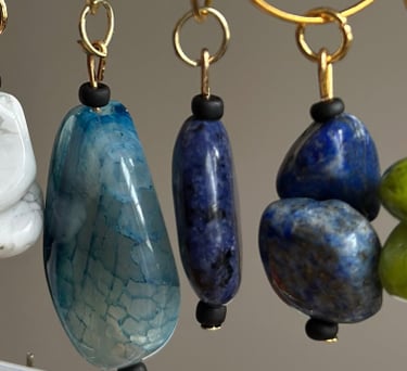 Rosevale Accessories handmade gemstone wine charms on jewelry display