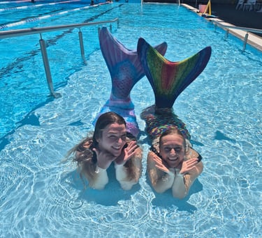 Adult Mermaids in a pool
