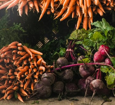 a bunch of vegetables are on display in a market