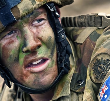 Close up of an Australian soldier in full camouflage uniform and face paint