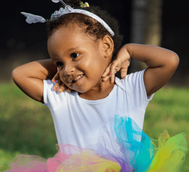Adorable young ballerina outside
