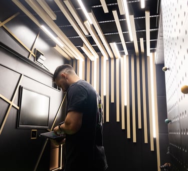 A team member of 1IRON indoor golf in the high tech bunker bay