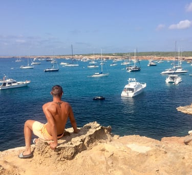 Francesco Margaretini overlooking sea with luxury boats on holiday 