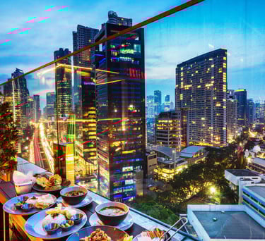 a table with plates of food and drinks in Sydney.