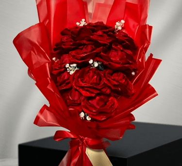 Arreglo de rosas rojas de listón 