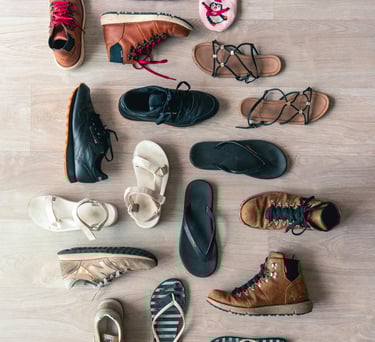 A collection of shoes, boots, sandals, and slippers