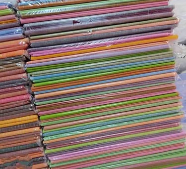 Assorted Colored Mulberry Silk Fabrics Rolled in Bundles – Ready for Weaving and Export from India