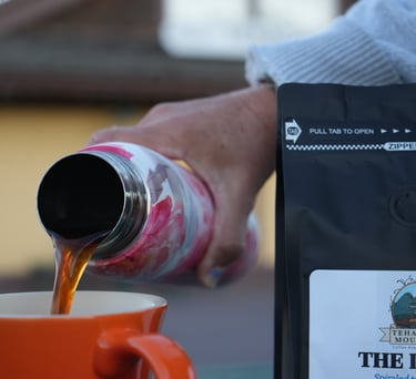 Coffee being poured from a carafe into a cup for the LOOP Roast by TM Coffee Roasting