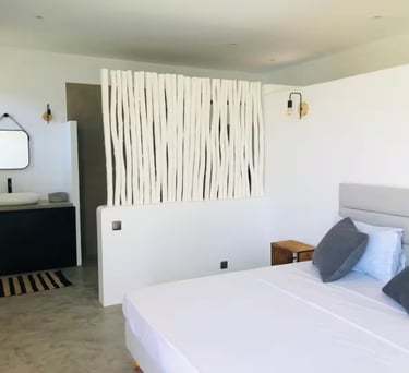 a bed with pillows and pillows on a bed