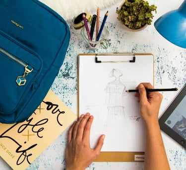 a person's hands are drawing a drawing of a human figure