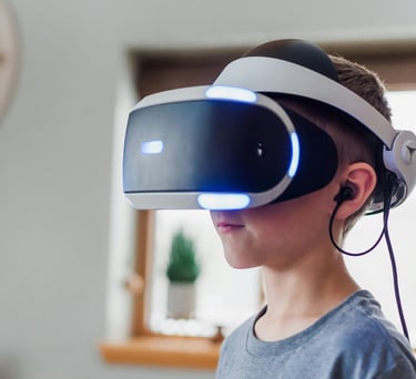 A boy wearing a virtual reality headset