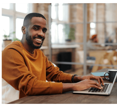 Writing Expert working on a laptop