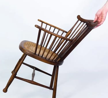 Vintage wooden rocking chair with spindle backrest