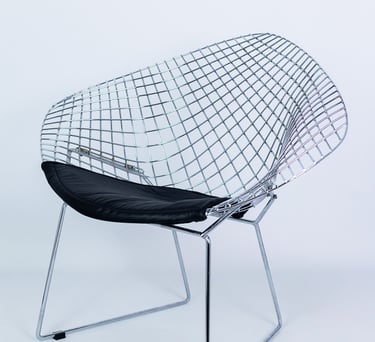 Metal wire designer chair with black cushion seat