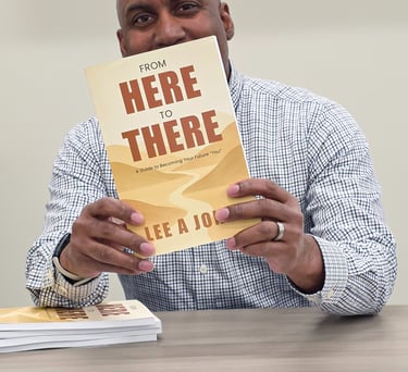 Lee A Jones holding a book with a book cover