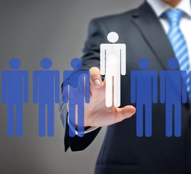 a man in a suit and tie is holding a paper cutout of a person