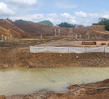 Silt fence installation near the river, bmp's or best management practice