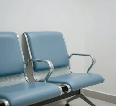 A modern waiting room chair in a minimalist and clean Hispanic medical clinic, featuring pale blue and white tones.