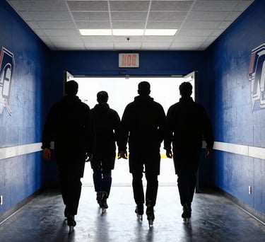 A team walking down a hallway towards the rink entrance, silhouettes against the bright light of the arena. The walls are royal blue with athletic decals. North American / US Southern university sports facility.