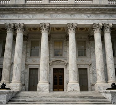 The Great Hall of a historic federal building in the US, showing towering marble columns and elegant architectural details in a symmetric composition.