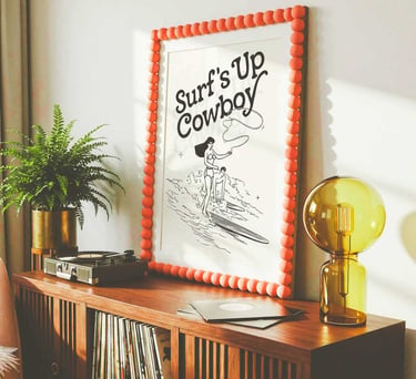 Surf's Up Cowboy vintage coastal wall art with retro surfing cowgirl illustration