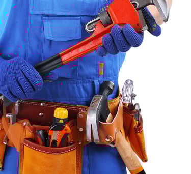 Professional technician holding plumbing tools for HVAC and plumbing maintenance services