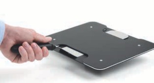 a person holding a laptop computer and a knife