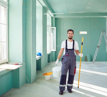 Equipo de pintores con equipamiento de seguridad para trabajos industriales en el Gran Bilbao
