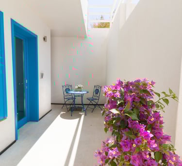 a patio with a table and chairs and a table