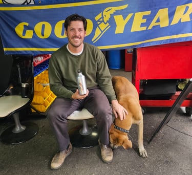 Happy customer with dog after tire installation at Fast Tire Shop East Los Angeles